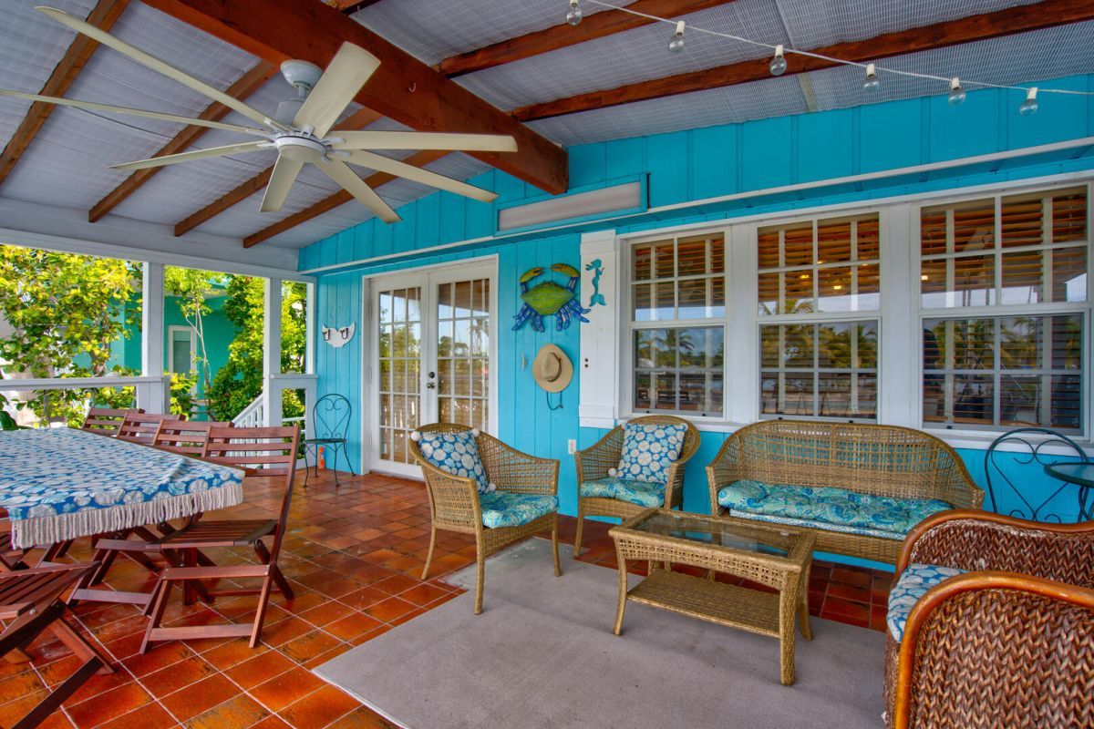 teal vacation rental with boat dock